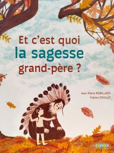 Un grand-père et son petit-fils sont assis proche du sol. L'automne est là les feuilles se massent sur le sol.